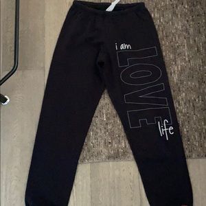 Black piece love world sweat pants